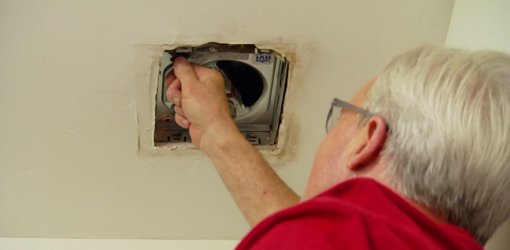 Danny Lipford installing bathroom vent fan.