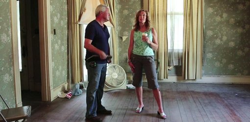 Esther de Wolde and Danny Lipford examine the ceiling in the historic Ford house.