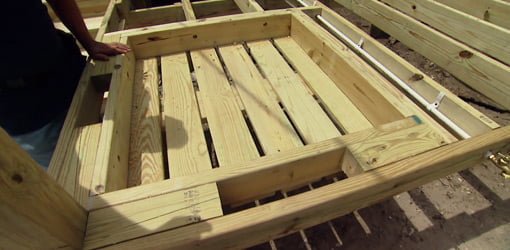 Framing for wood deck sandbox.
