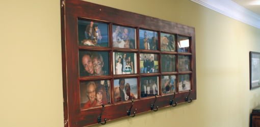 French door photo gallery and coat rack mounted on wall.