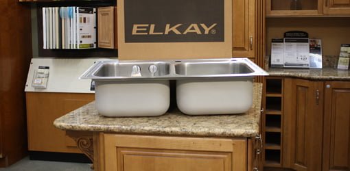 Elkay Magna double bowl kitchen sink sitting on countertop.