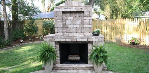 Outdoor fireplace made with Pavestone pavers.