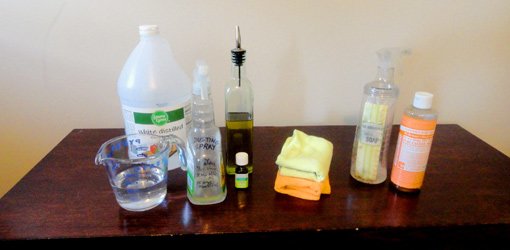Cleaning supplies on wood table.