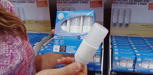 Holding package of GE Bright Stik LED Light Bulbs.