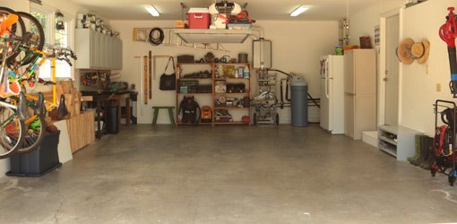 Organized garage with shelves, overhead storage, and wall-mounted bike racks.