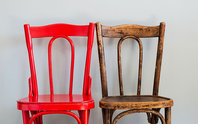 Painted wooden chair, at left, and old unfinished wooden chair at right