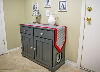 Upcycled hutch, turned kitty litter box, inside a home