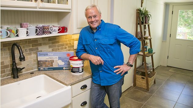 Danny Lipford with SimpleMat tile setting mat and Fusion Pro grout, which make installing a backsplash more DIY-friendly. 