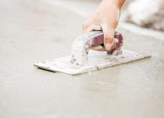 Smoothing cement with trowel