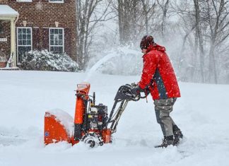Danny Lipford uses snow blower during winter