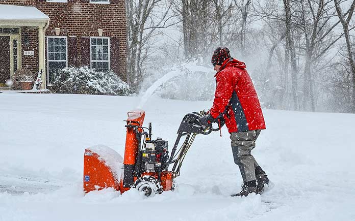Danny Lipford uses snow blower during winter