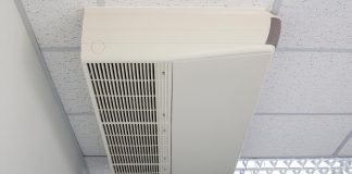 Packaged thermal air conditioner, seen close up, installed on a ceiling