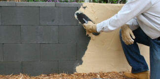 Applying a stucco finish to a concrete block wall