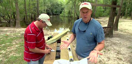Allen Lyle and Danny Lipford tackle outside a river cabin.