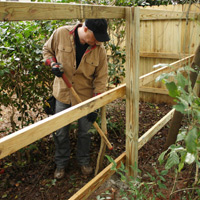Danny Lipford working on fence.