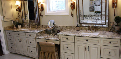 His and her vanities with Merillat cabinets and granite countertops.