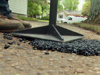 Tamping asphalt repair.