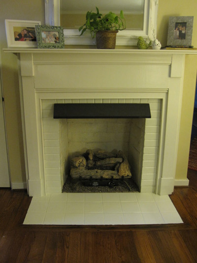 Painted fireplace and hearth.