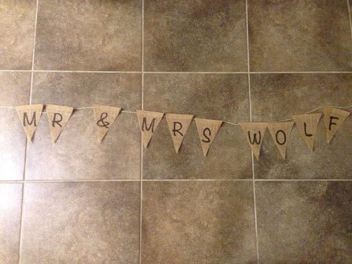 Burlap bunting letters in one long line on floor