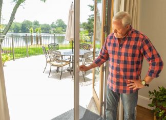 “Today’s Homeowner” host Danny Lipford tests a retractable screen door from Wizard Screens