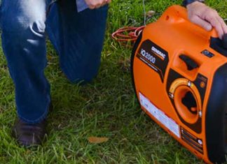 Portable Generac Generator resting on a lawn