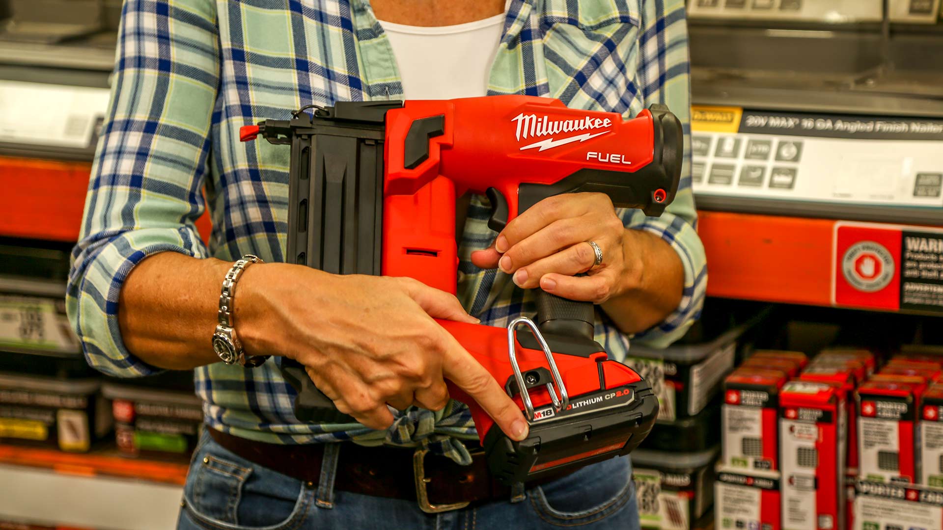 Jodi Marks holds a Milwaukee Brad Nailer in a Home Depot store during a Best New Products taping.