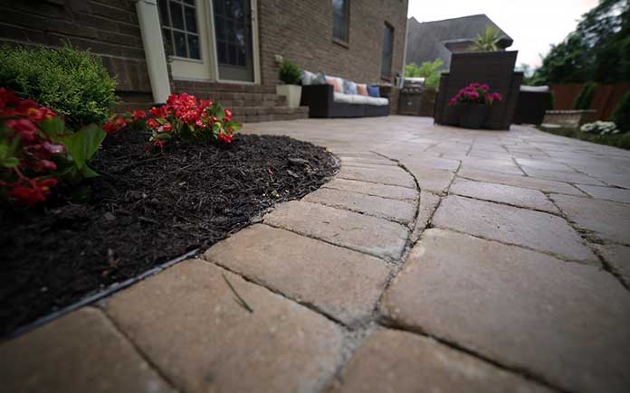 Pavestone paver patio with nearby landscaping at a Tennessee home