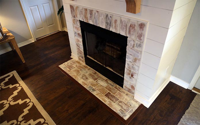 Rustic fireplace with shiplap surround