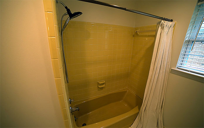 Yellow tub and shower