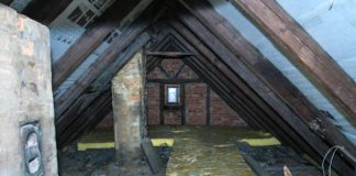 Old attic with soot stains and moisture