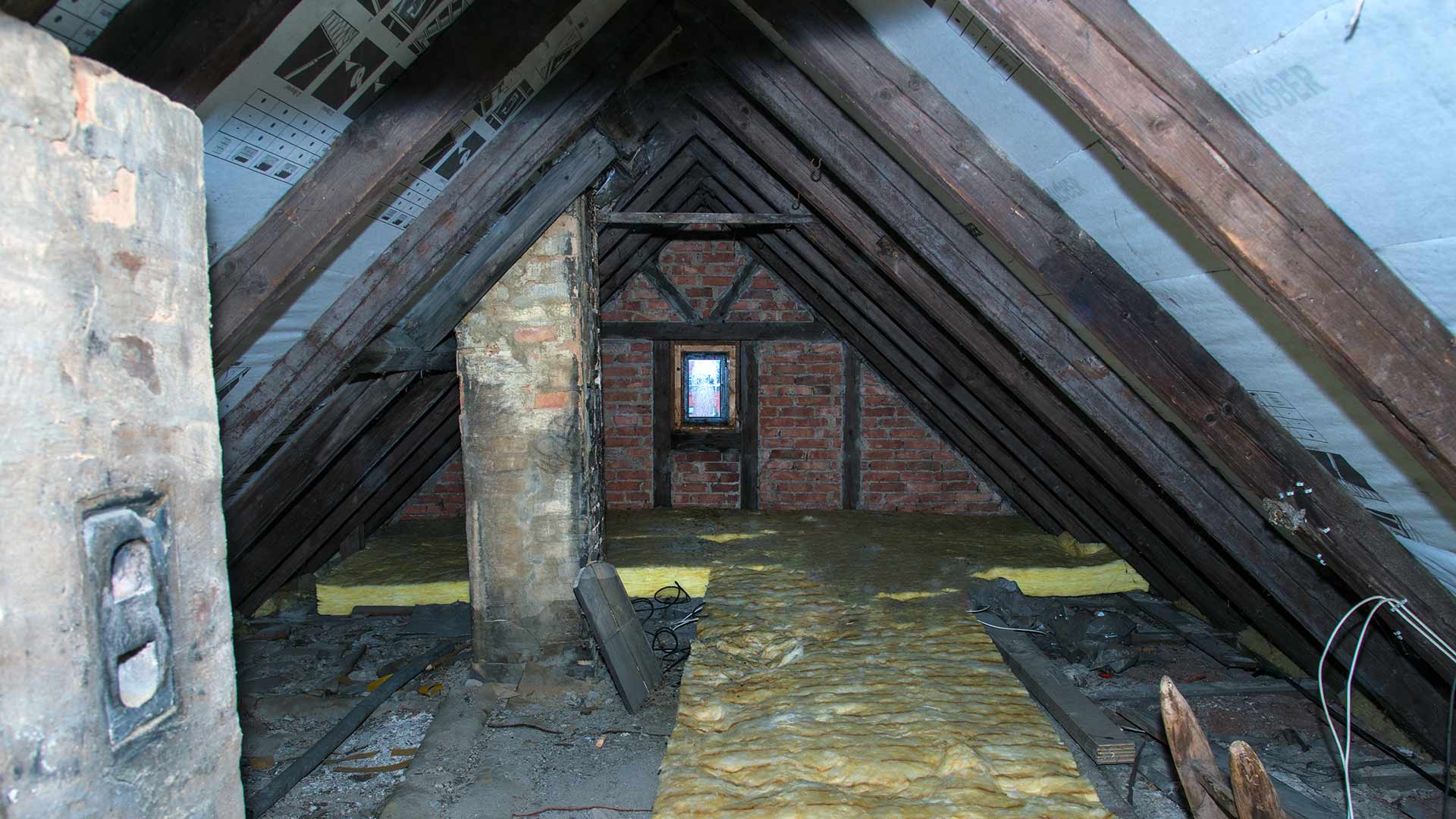 Old attic with soot stains and moisture