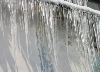 Ice dam, as seen on the side of a home in the winter