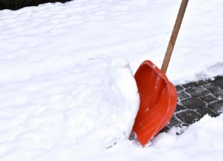 Removing snow with a snow shovel
