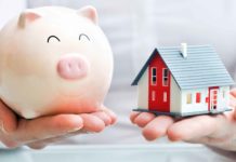 Piggy bank and house symbolizing real estate