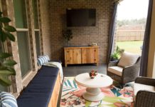 Patio after makeover with window seat, area rug and cedar buffet