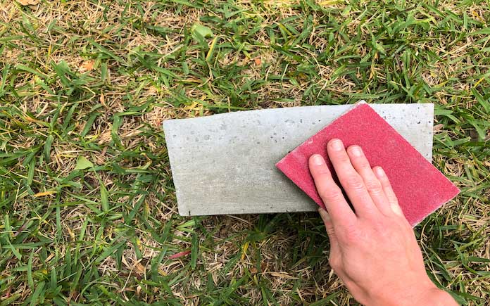 Chelsea Lipford Wolf sands her concrete planters