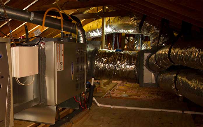 Air conditioner ductwork in an attic
