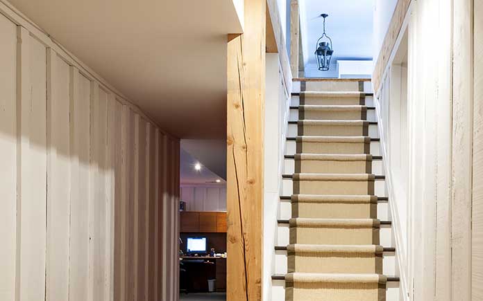 Hardwood stairs with carpet runner