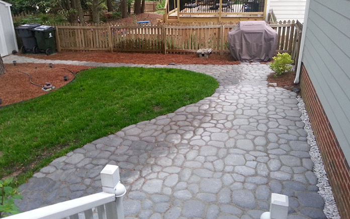 Gray DIY concrete patio made from Quikrete WalkMaker
