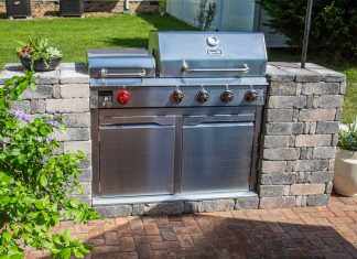 Beautiful Dyna-Glo gas grill with Pavestone grill surround