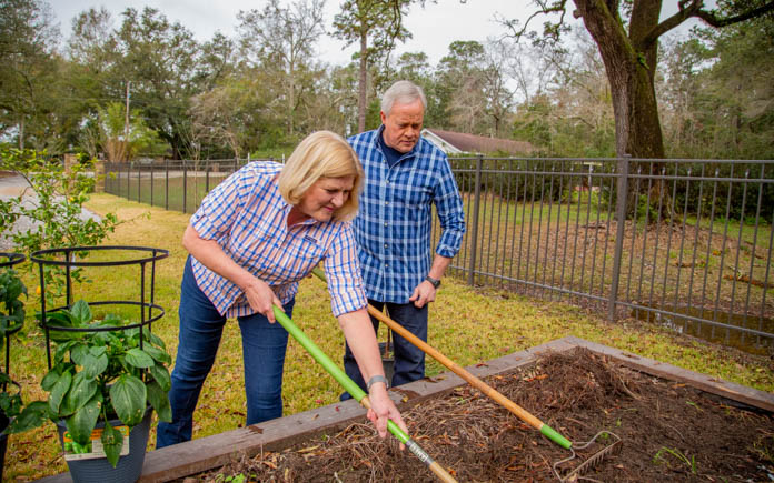 “Today’s Homeowner” host Danny Lipford and his wife, Sharon, tend to a raised garden bed