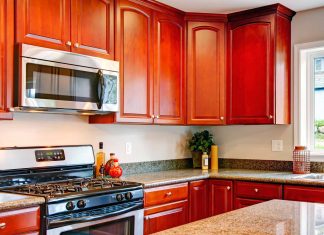 Cherry wood cabinets in a kitchen photographed in 2015