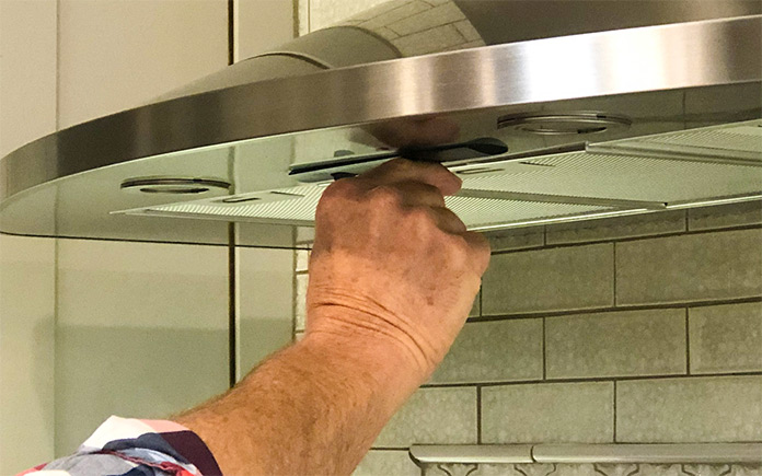 Danny Lipford, host of Today's Homeowner, turns on his range hood after an evening of cooking