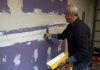 Danny Lipford, host of Today's Homeowner, installs Purple XP drywall on some garage walls.