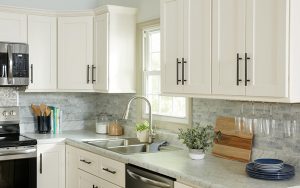 White shaker cabinets with gorgeous black pulls in a modern kitchen