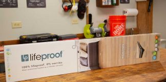In a Best New Product segment of Today's Homeowner, Jodi Marks stands in a workshop holding the Home Depot product Lifeproof Luxury Vinyl Wood Plank Flooring.