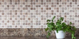 Ceramic tile backsplash with granite countertop in a modern kitchen
