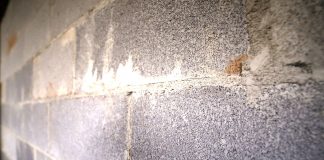 Concrete wall stained with efflorescence