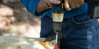Simple Solutions host Joe Truini drills holes in plywood