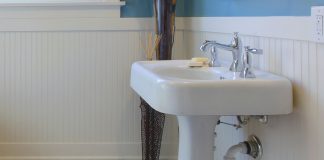 White cast iron sink in a mid-century modern bathroom
